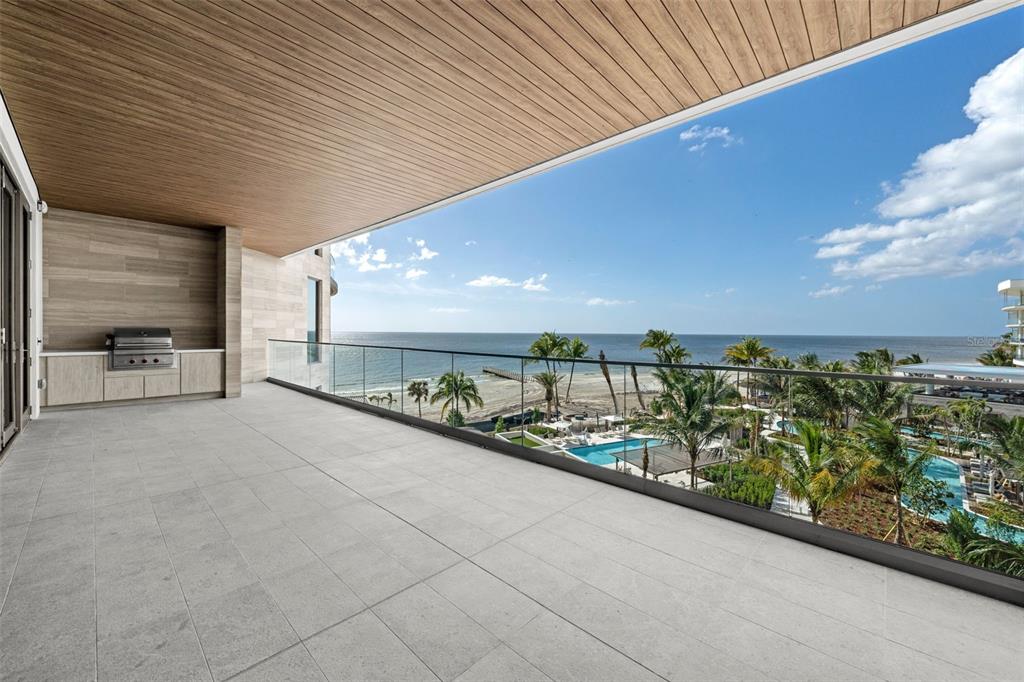 a view of swimming pool with outdoor seating