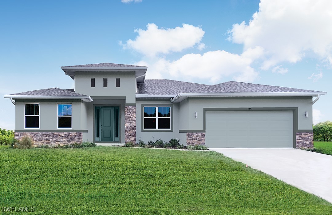 a front view of a house with a garden and yard