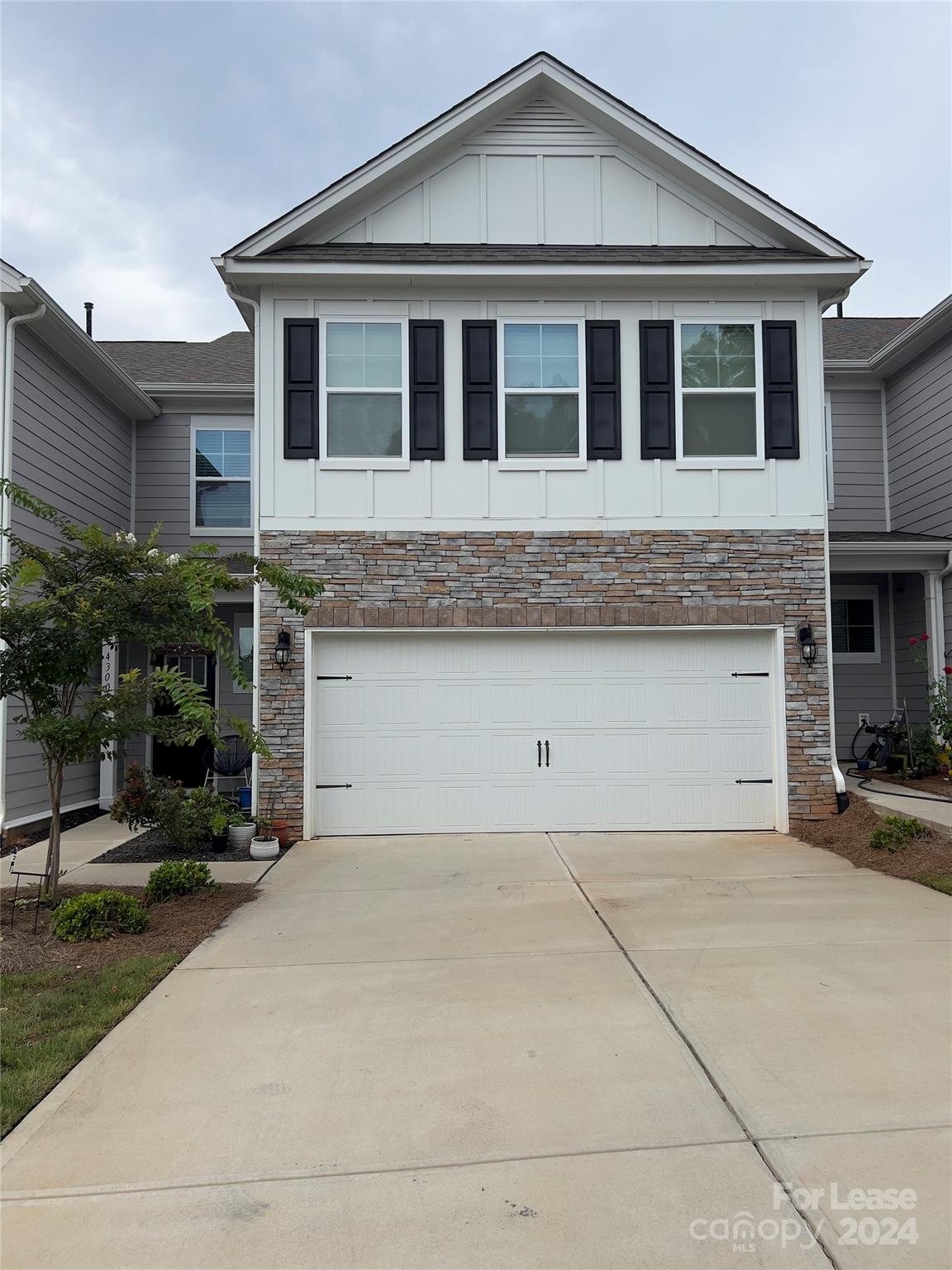 a front view of a house with yard