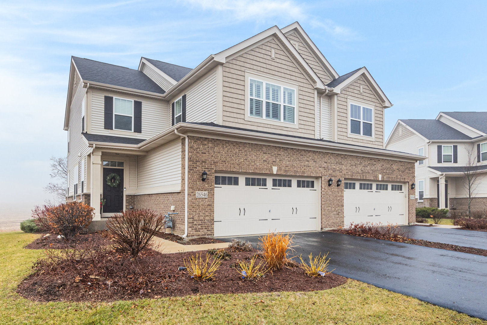 a front view of a house with a yard