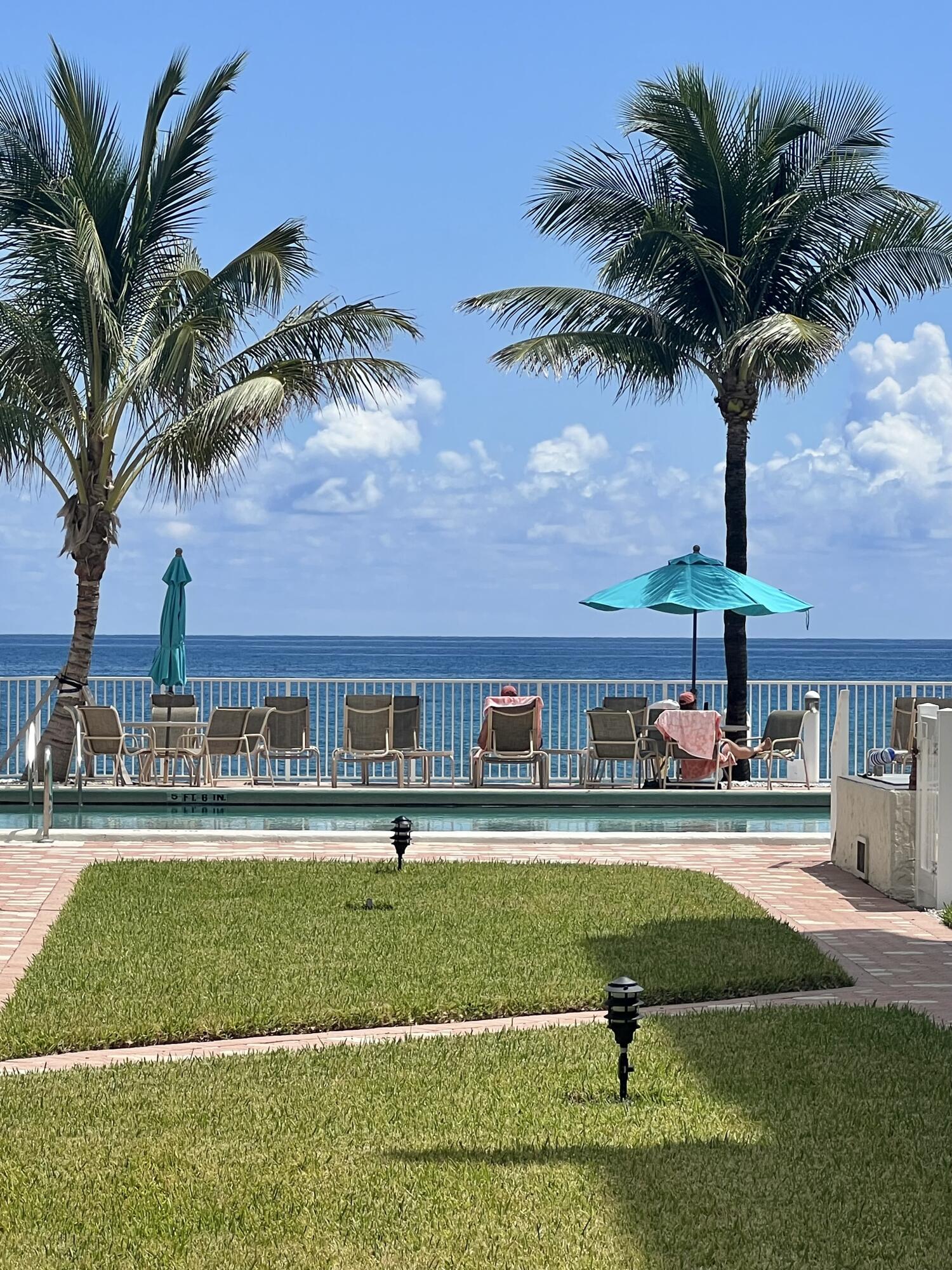 a house view with swimming pool and patio