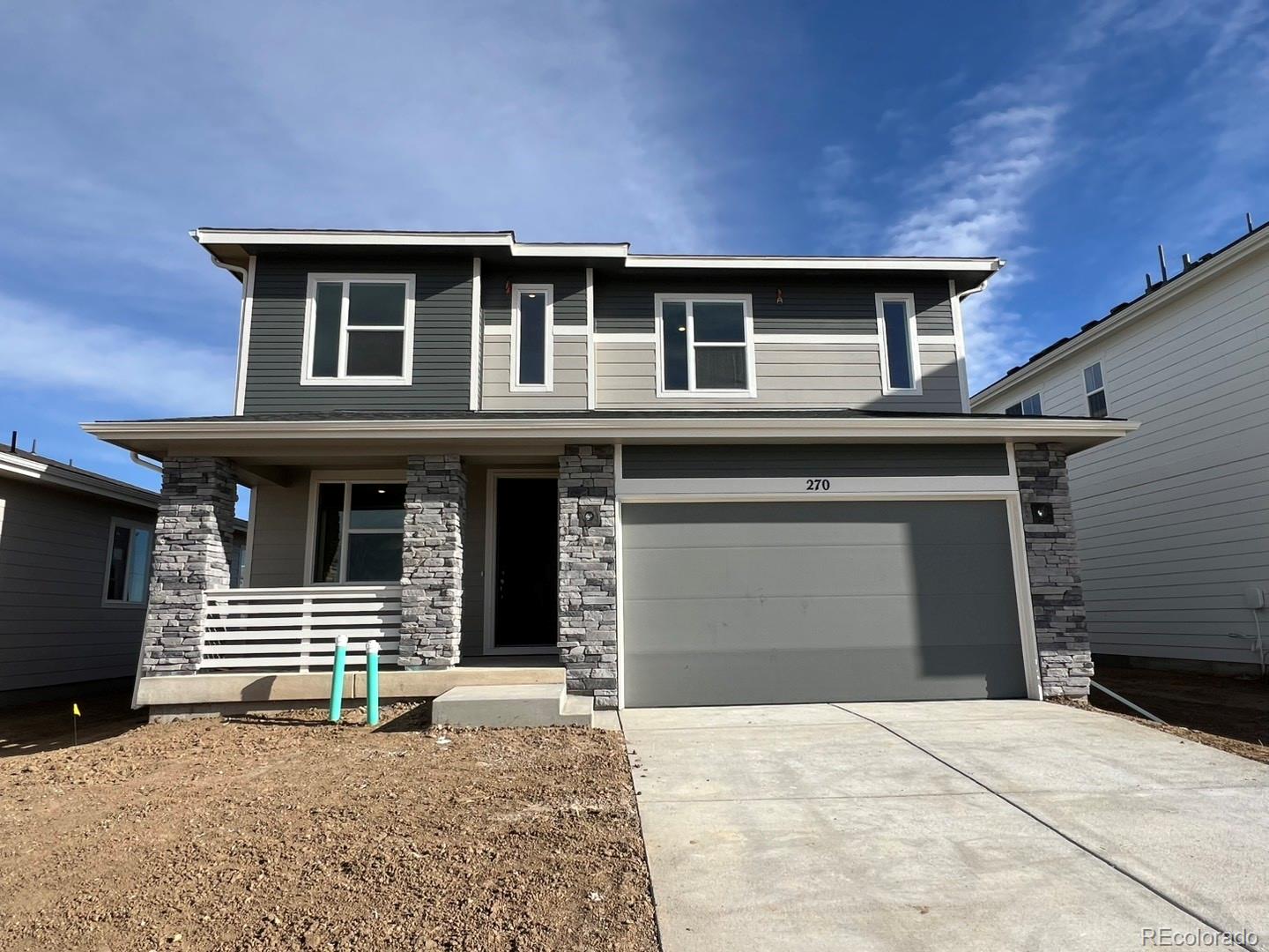 a front view of a house with a garage