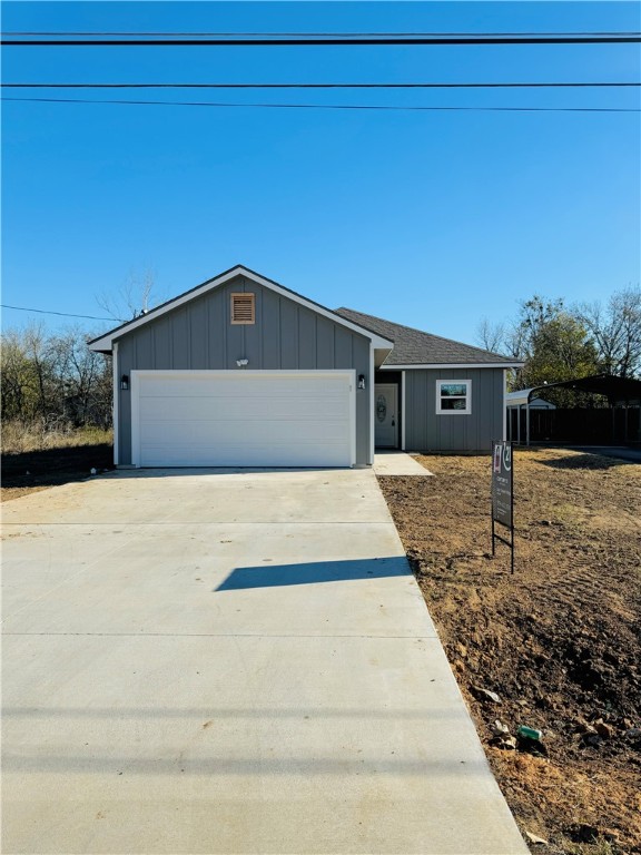 View of front of home featuring a garage