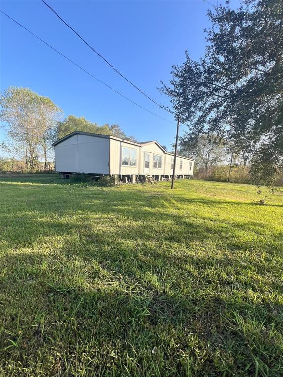 a view of a house with a big yard