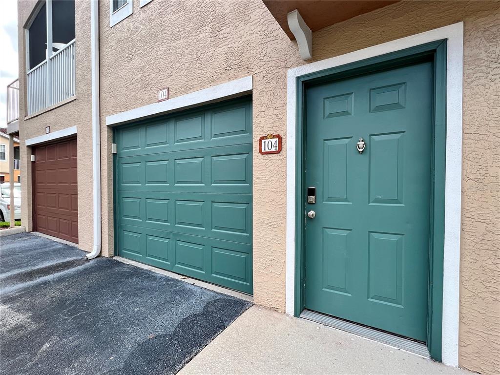 a view of front door and small yard