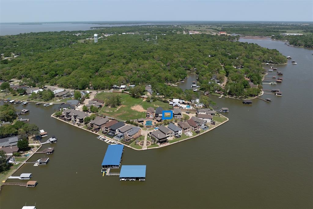 an aerial view of a house with a lake view