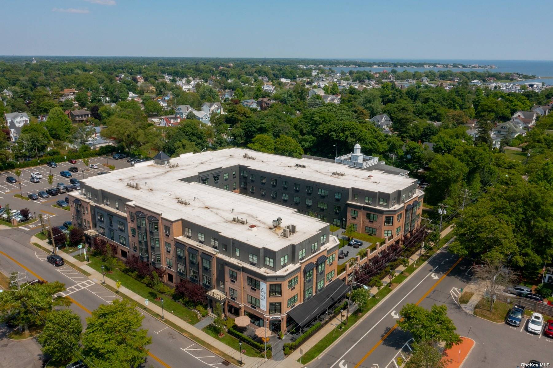 an aerial view of a house with a big yard