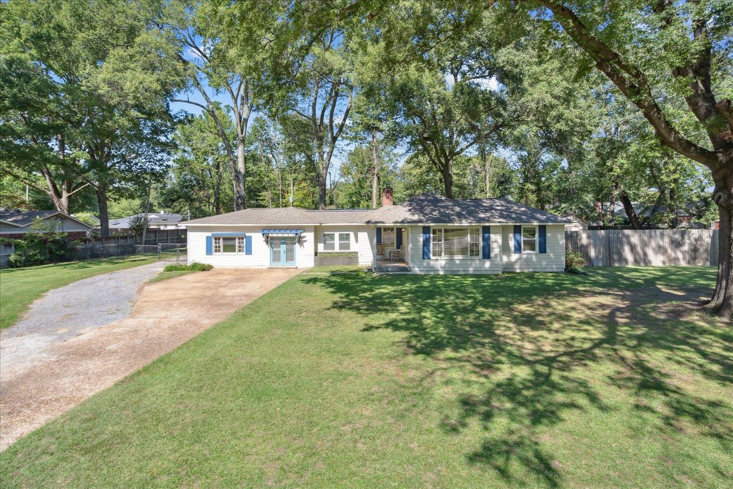 Ranch-style home with a front yard