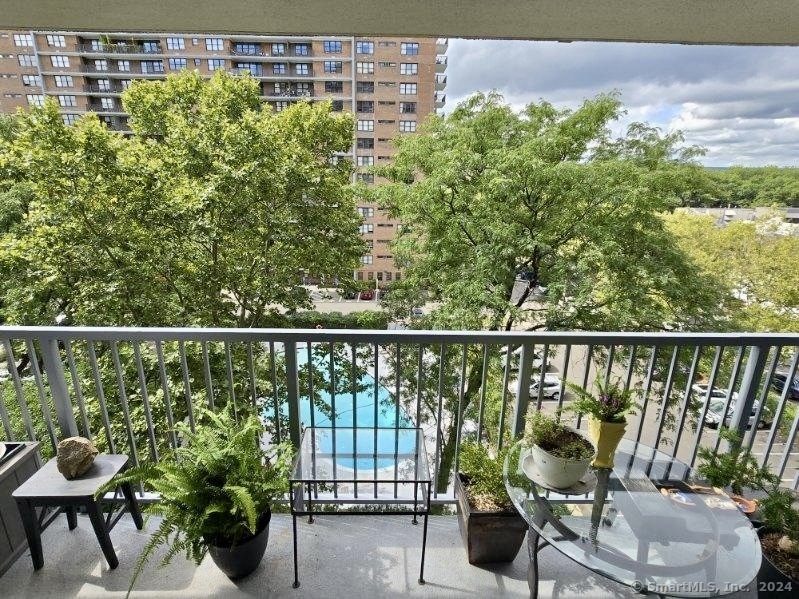 a view of a balcony with chairs