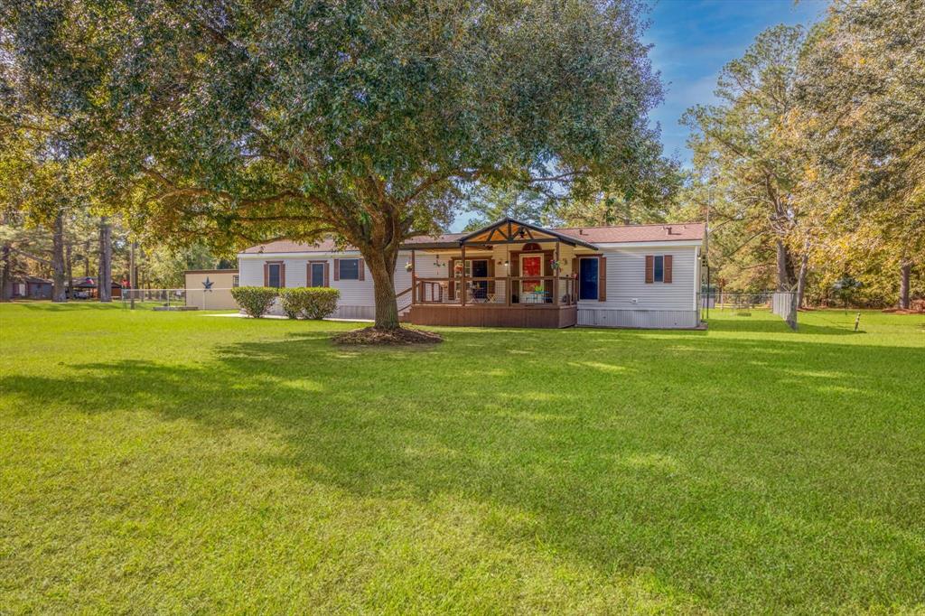 a view of a house with a big yard