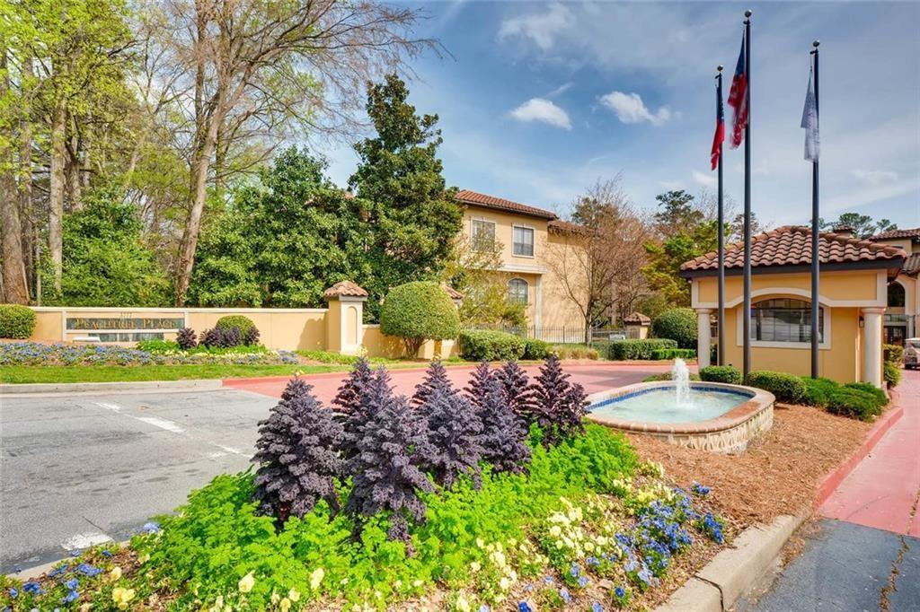 a view of a water fountain in front of a house