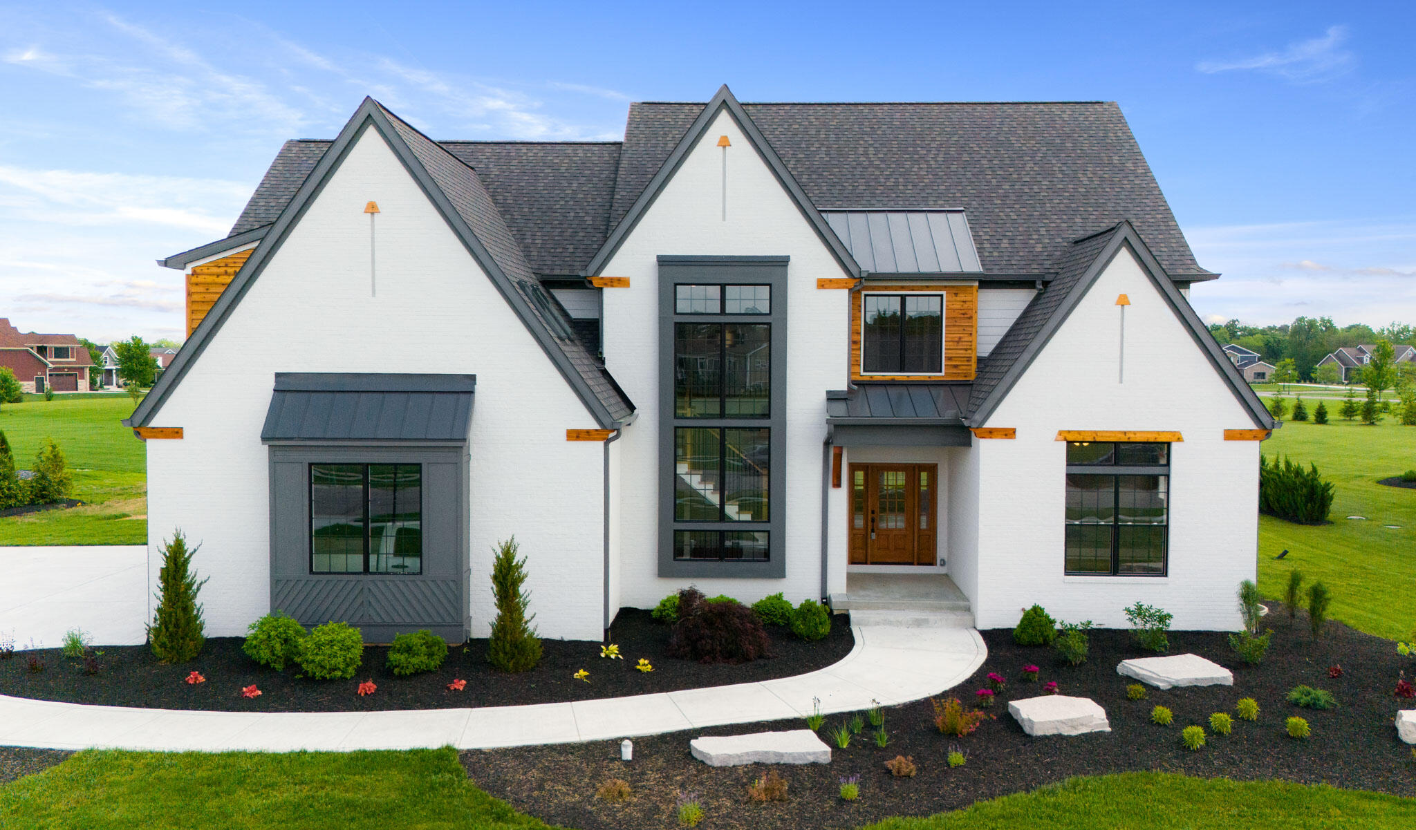 a front view of a house with garden