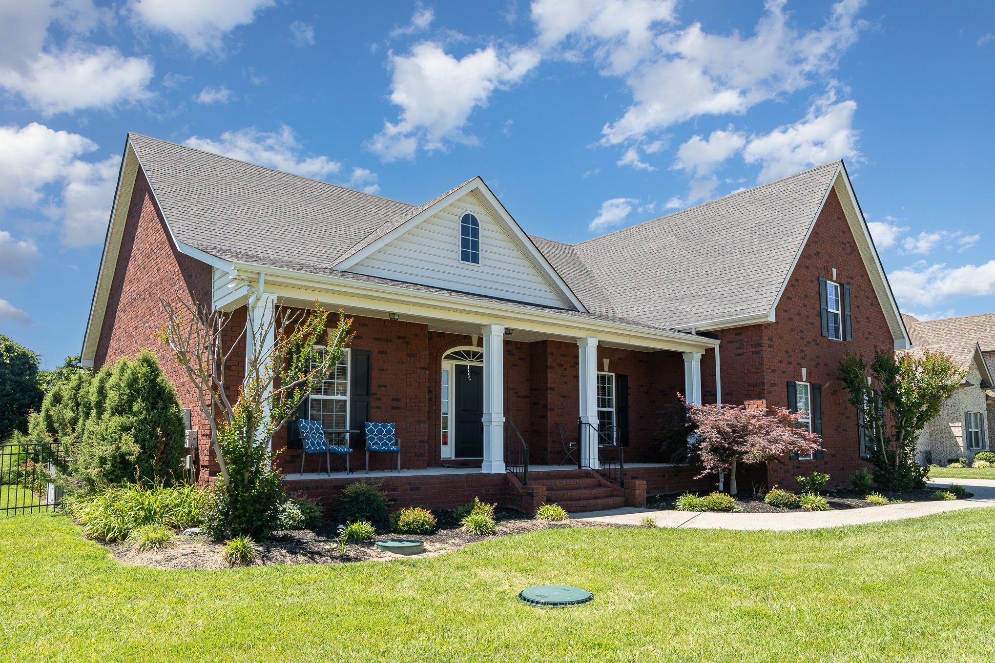 a front view of a house with a yard