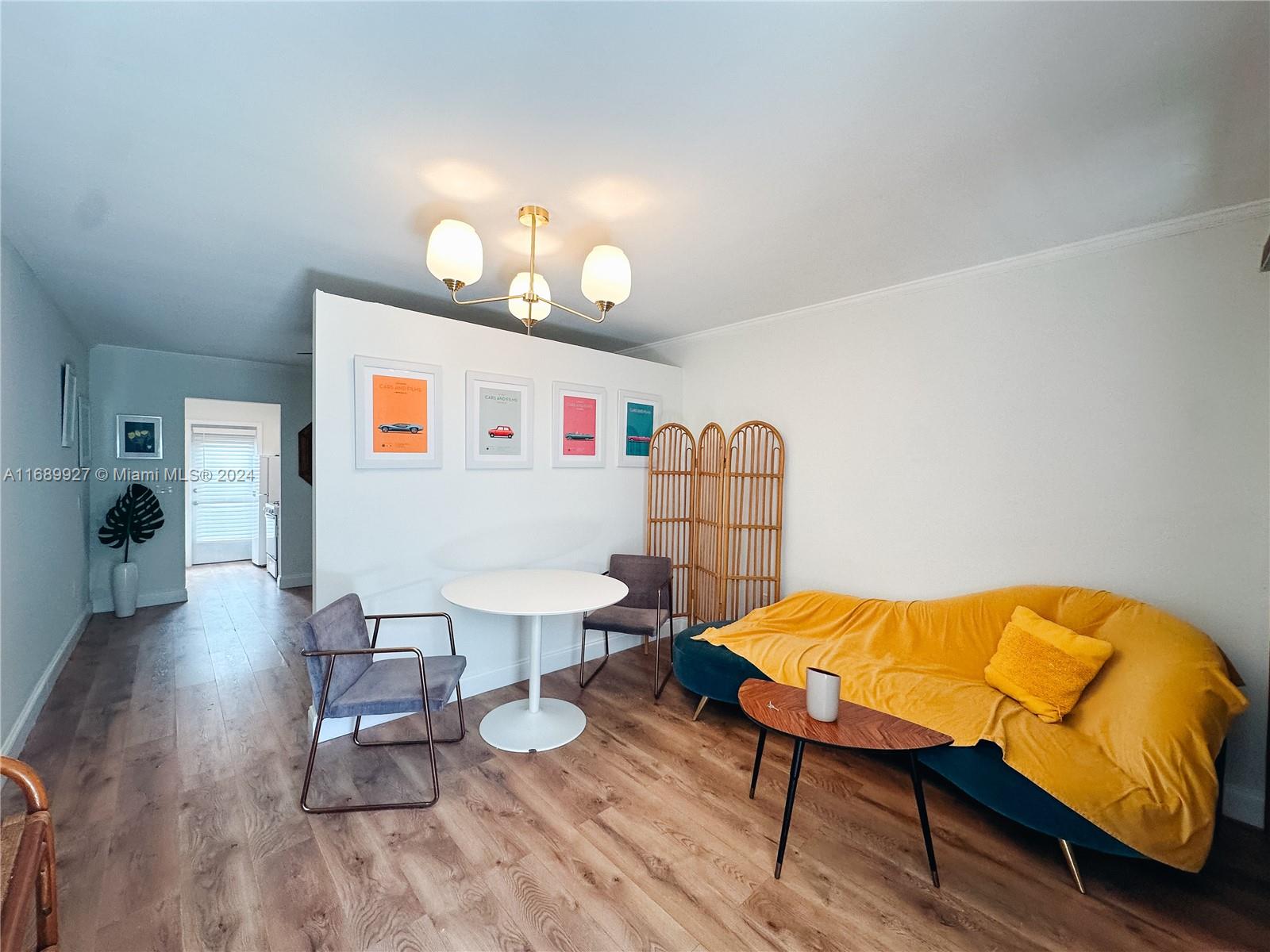 a bedroom with furniture and a wooden floor