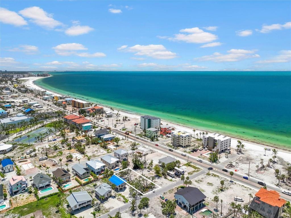 Aerial view with a water view and a view of the beach