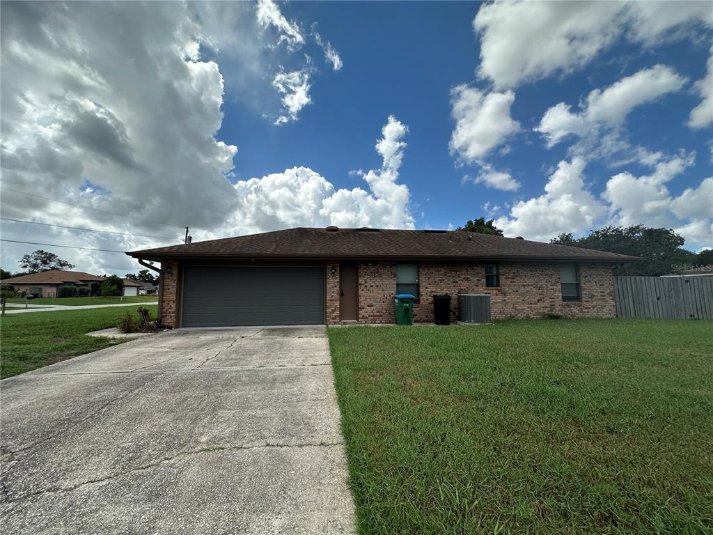 a brick building with a yard