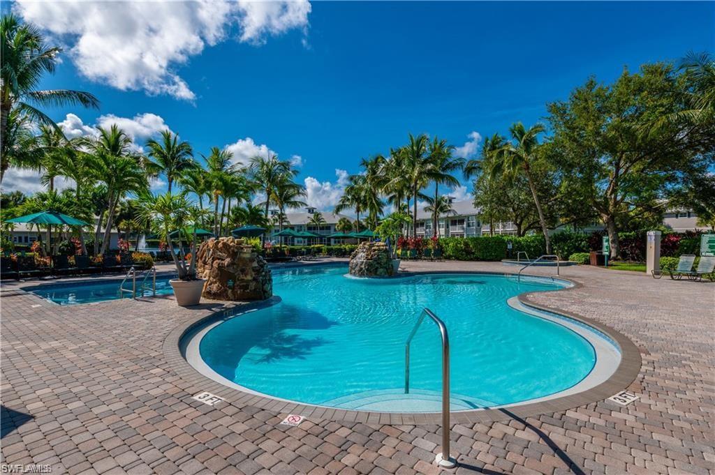 a view of a swimming pool with a patio