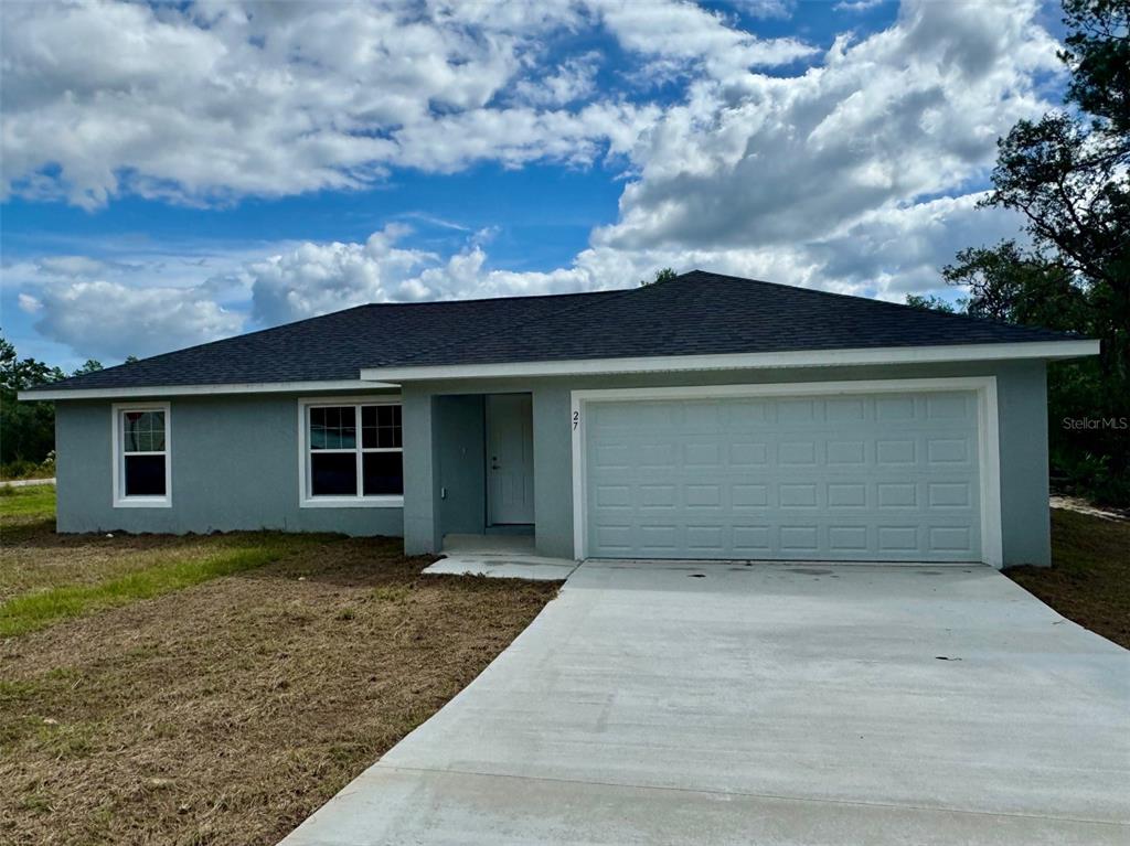 a view of a house with a garage