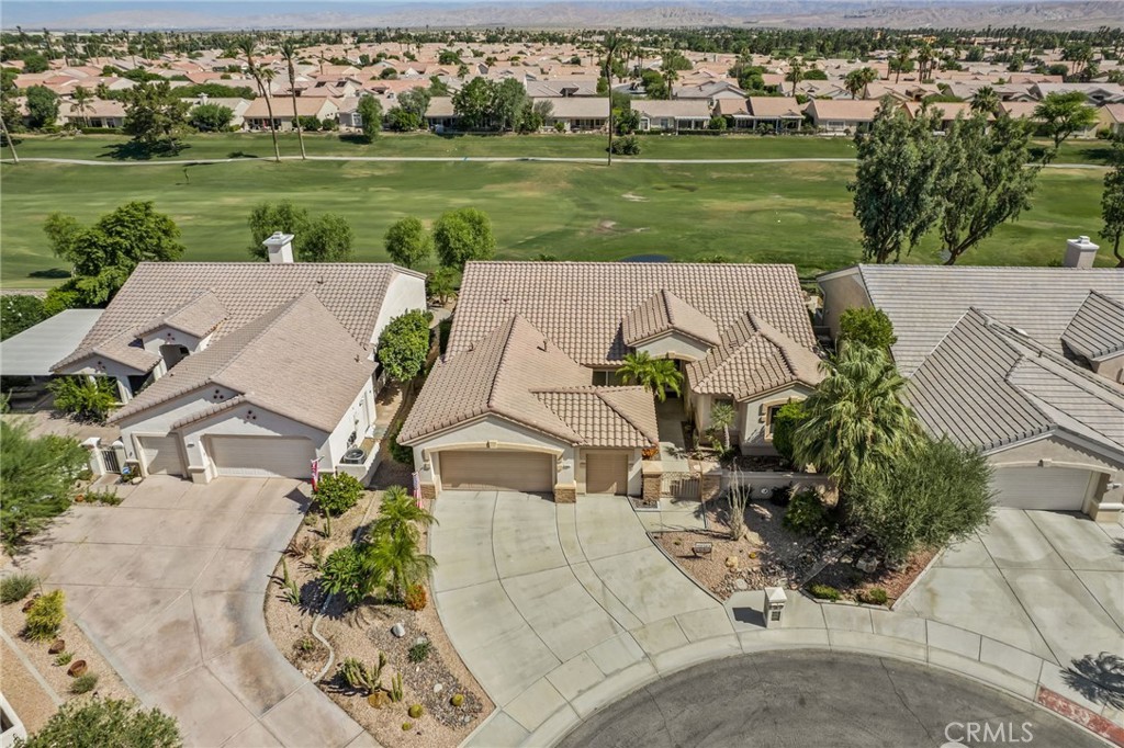 an aerial view of a house with big yard