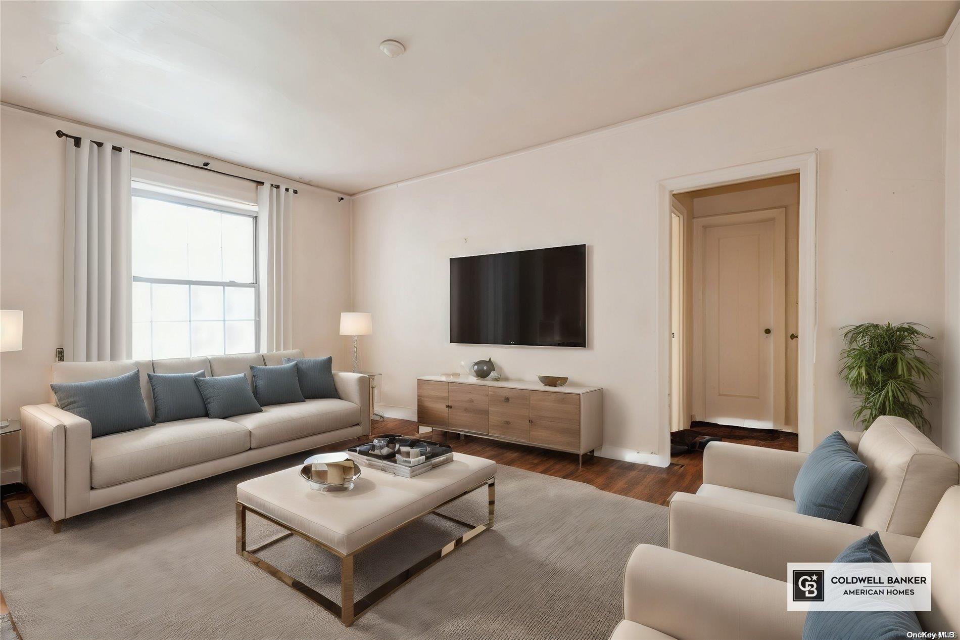 a living room with furniture and a flat screen tv