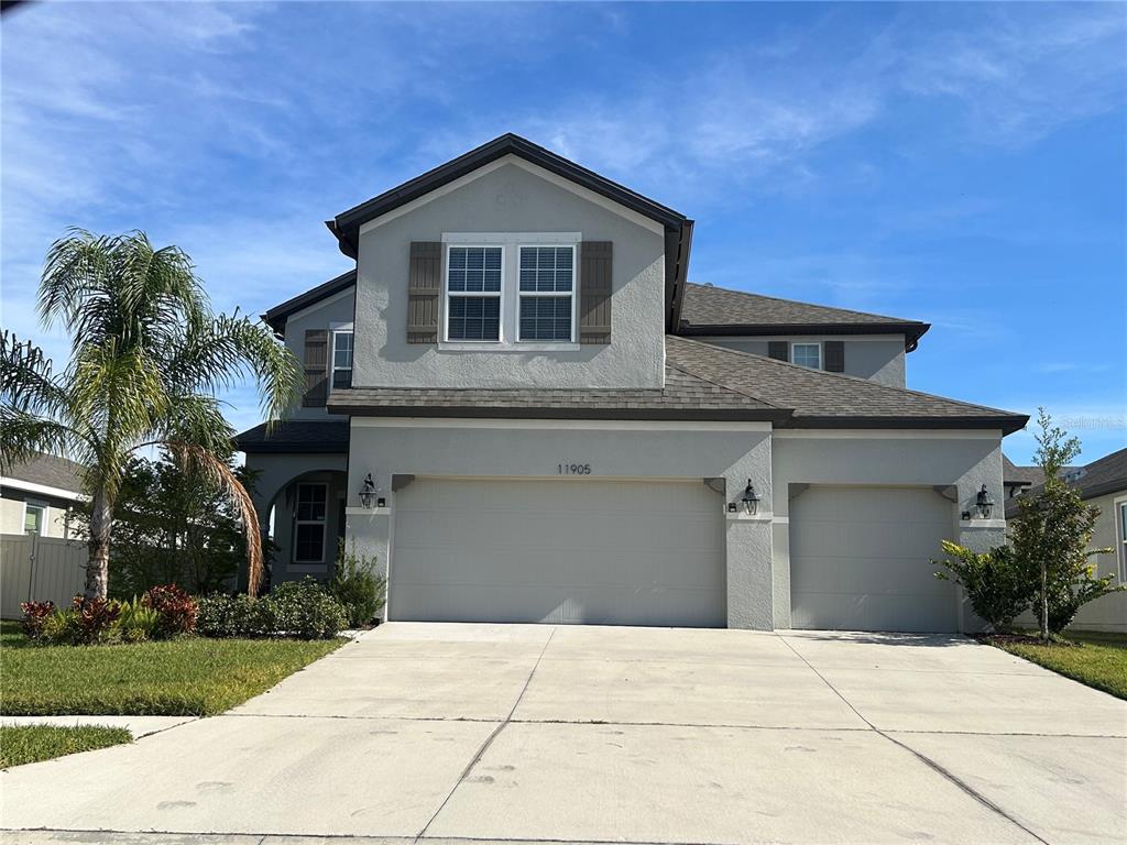 a front view of a house with a garage