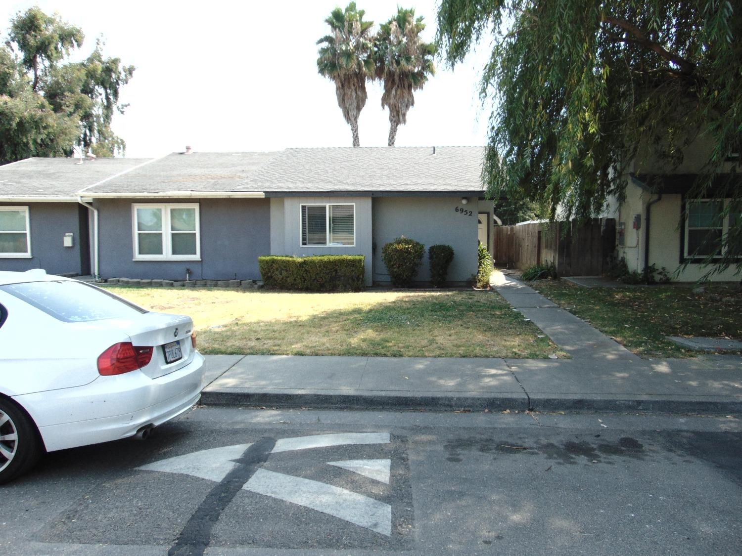 a front view of a house with yard