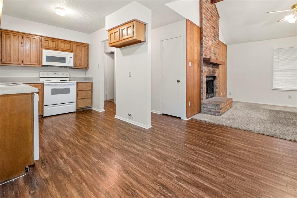 a kitchen with stainless steel appliances a refrigerator and a stove top oven