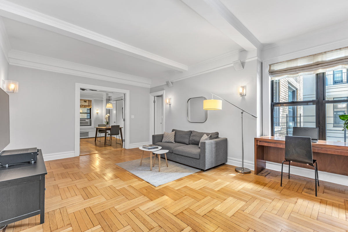 a living room with furniture and a table