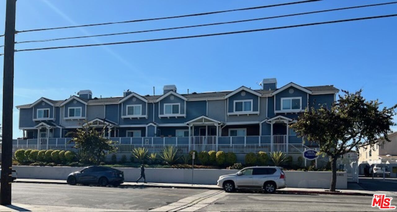 a view of a street in front of a house