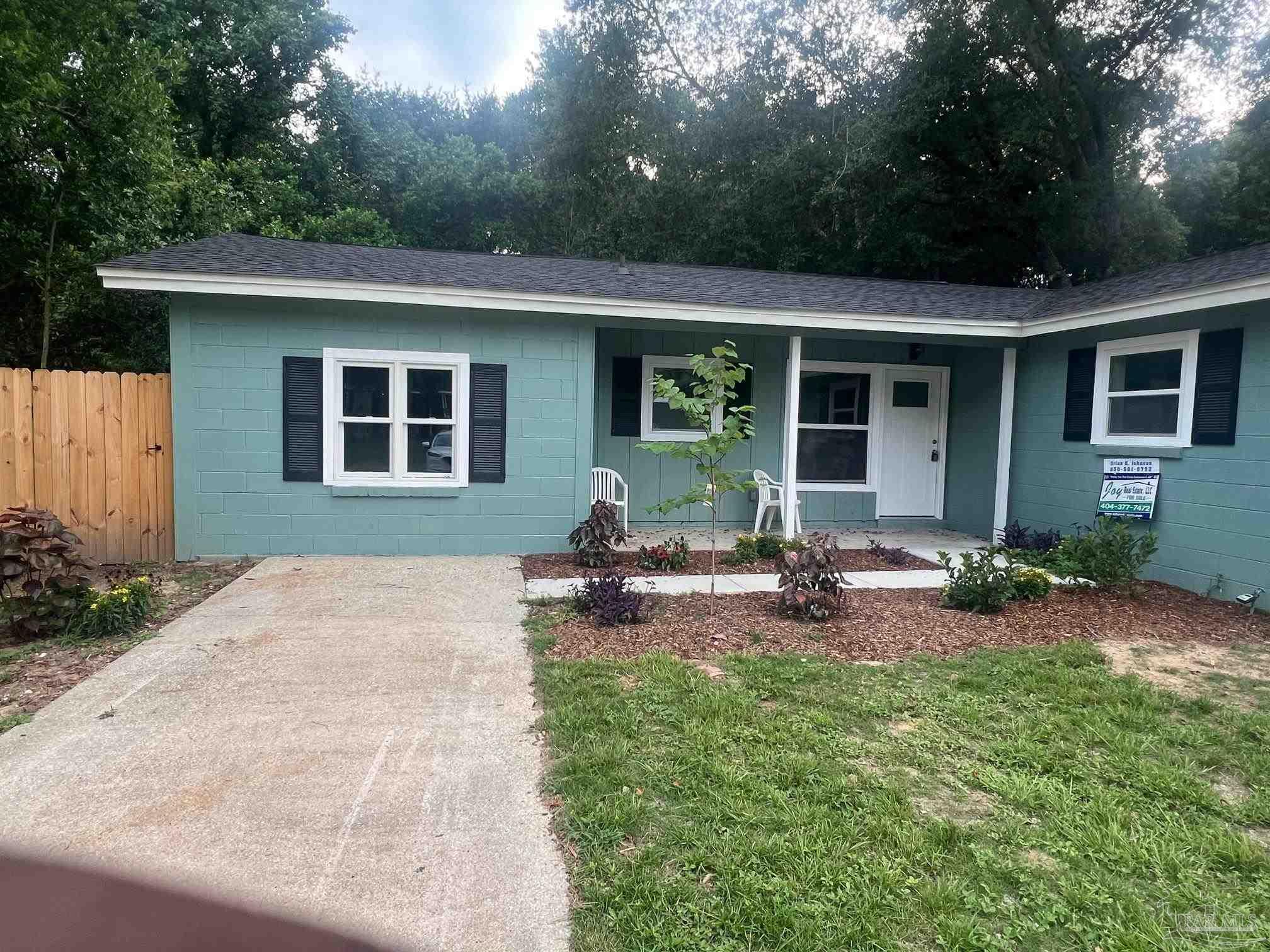 front view of a house with a patio