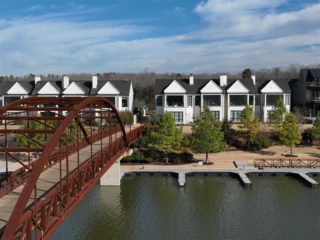 a front view of a house with a lake view