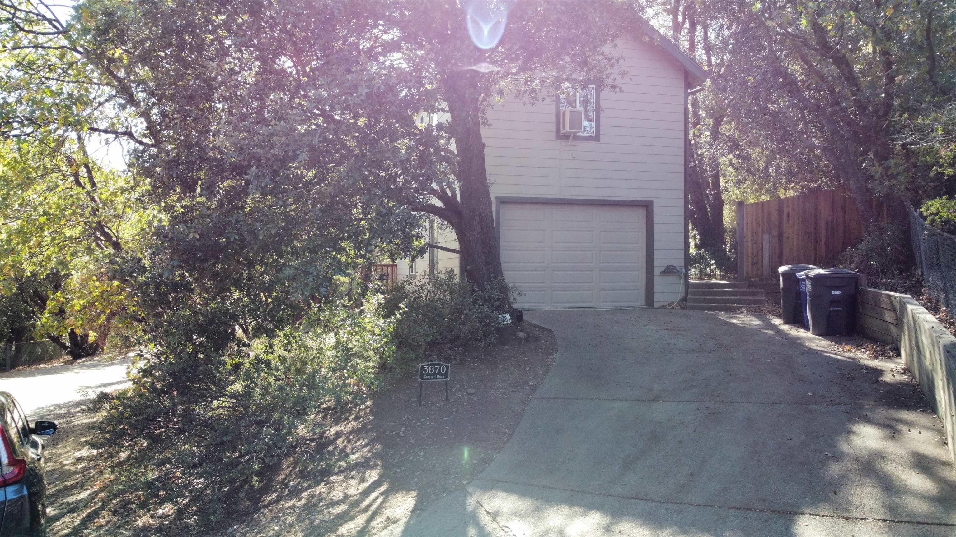 a view of a house with a street