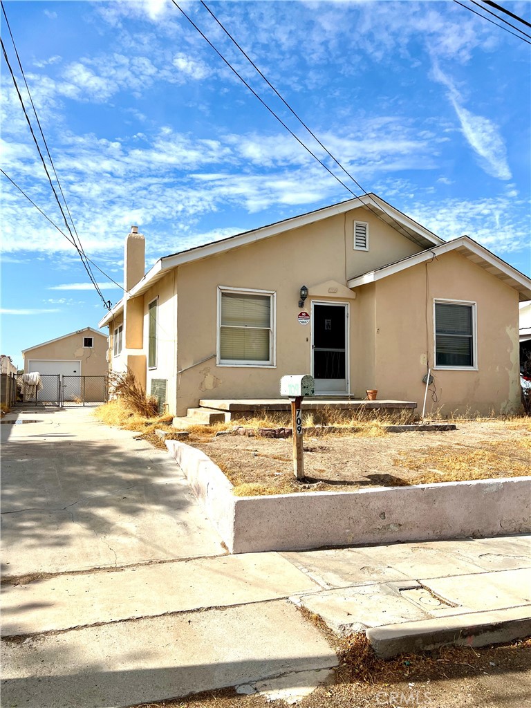 a view of a house with snow on the background