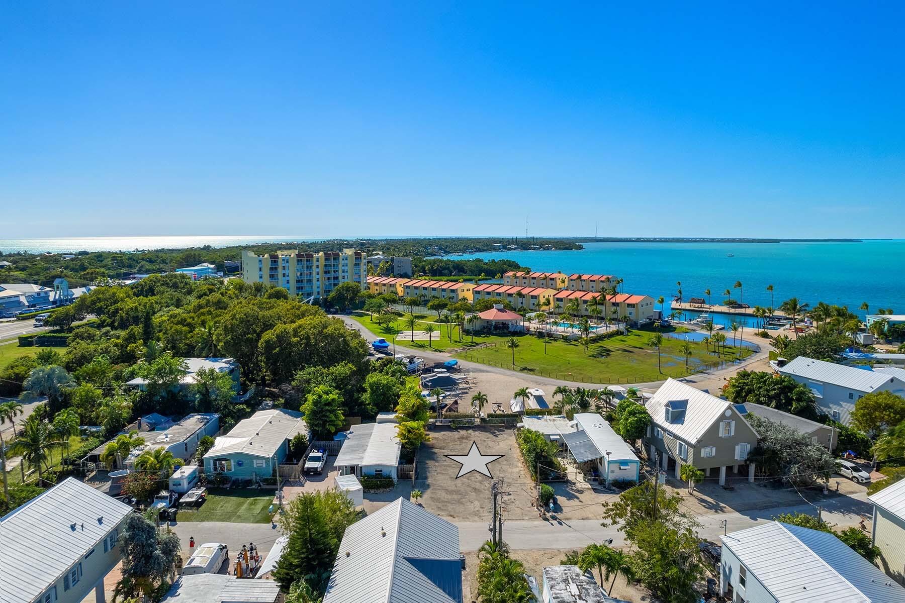 an aerial view of a houses with outdoor space