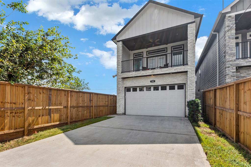 a front view of a house with garage