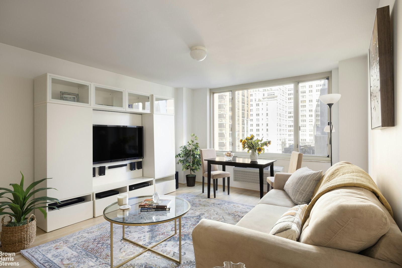 a living room with furniture and a flat screen tv