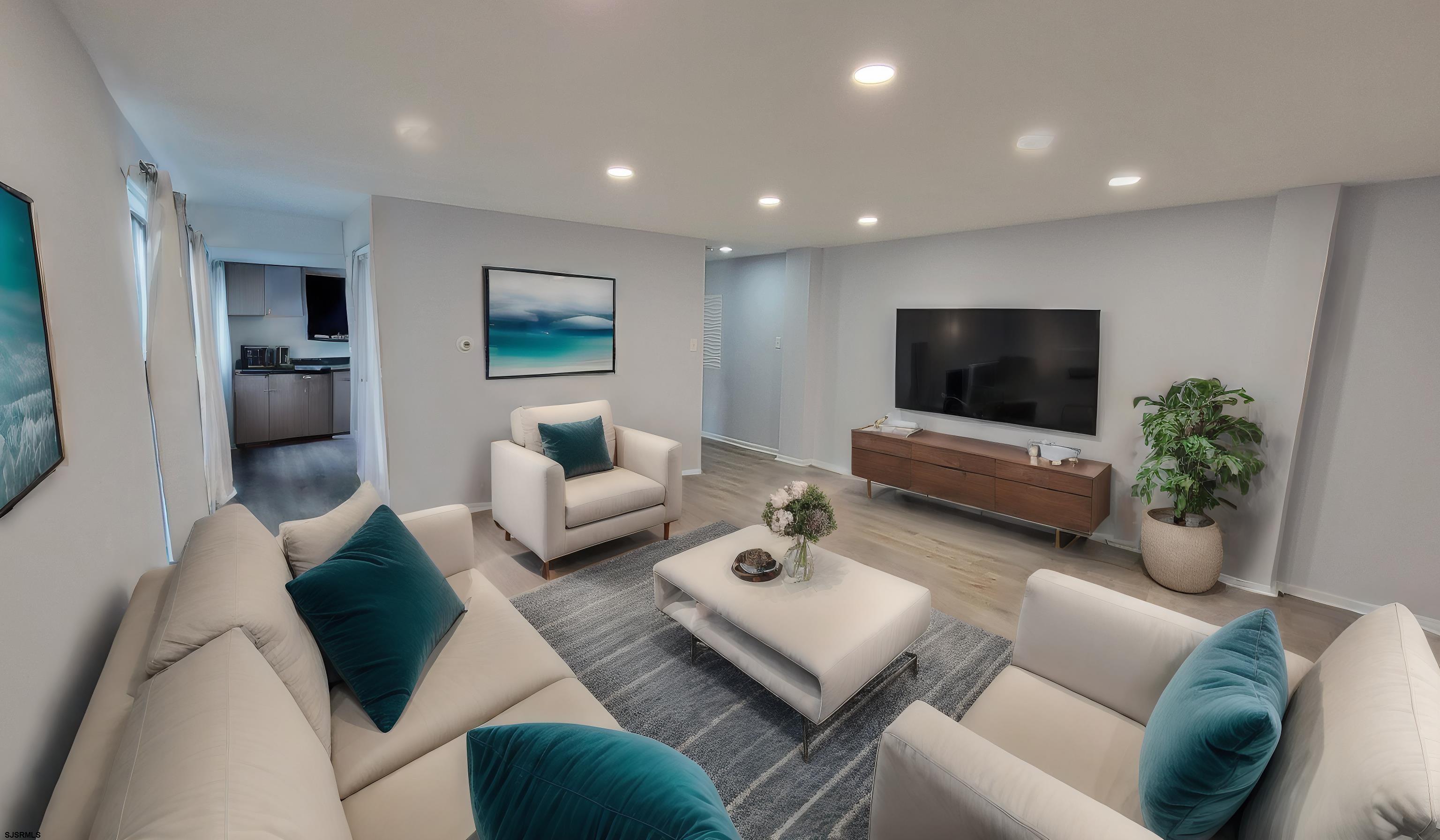 a living room with furniture and a flat screen tv