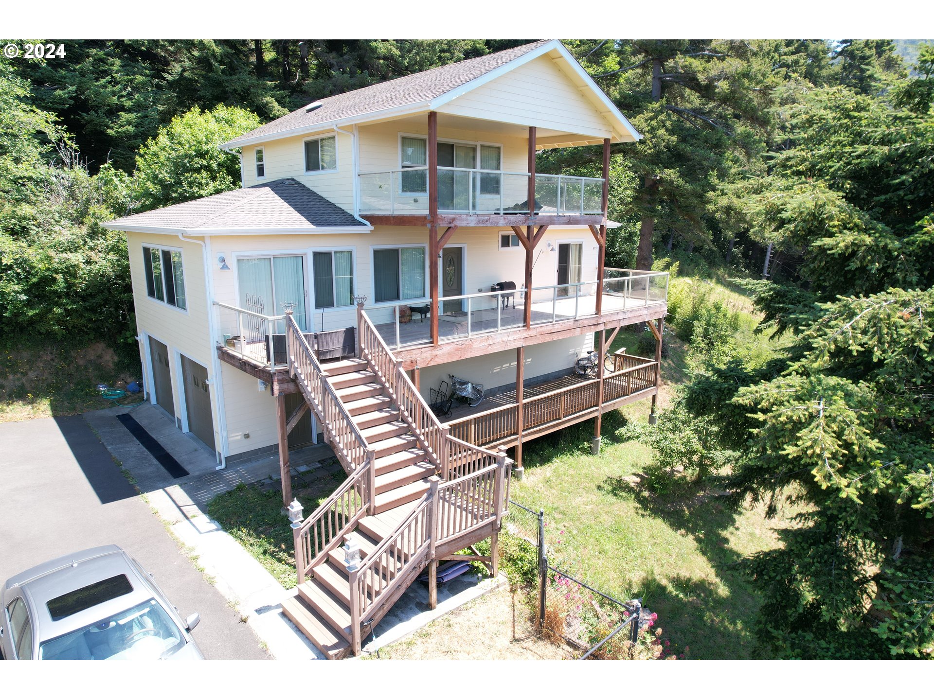 a front view of house with yard outdoor seating and barbeque