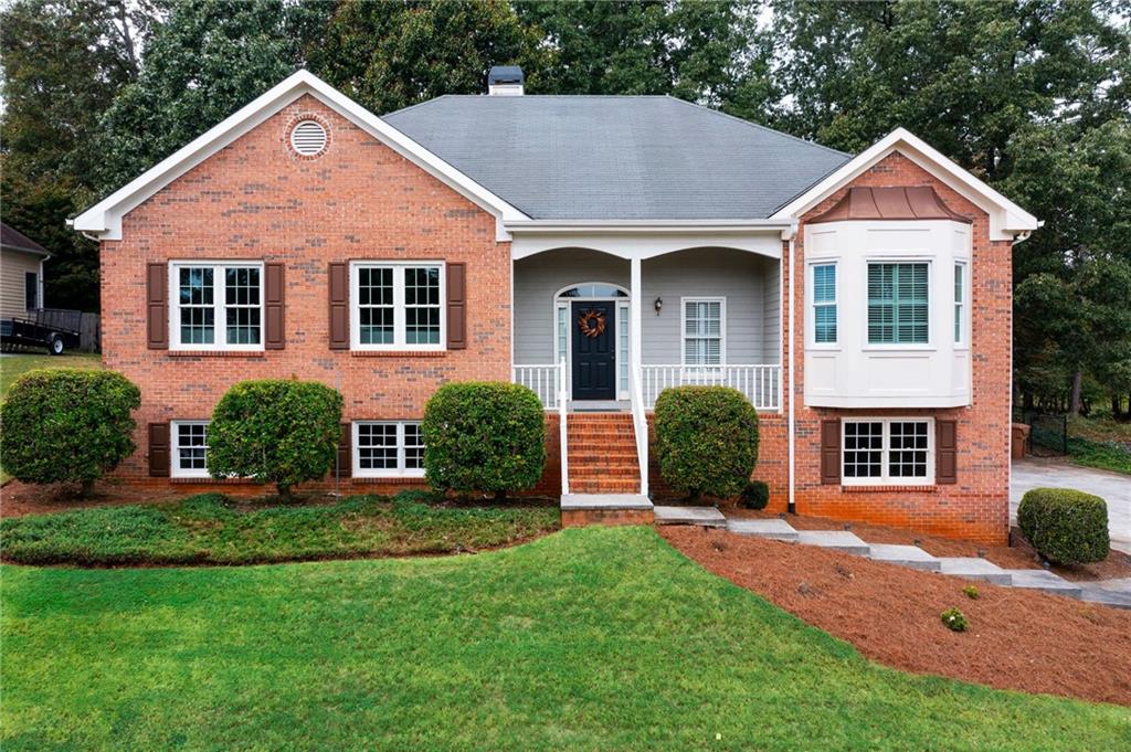 a front view of a house with a yard