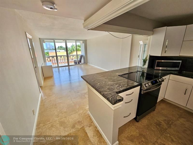 a kitchen with a stove and a microwave