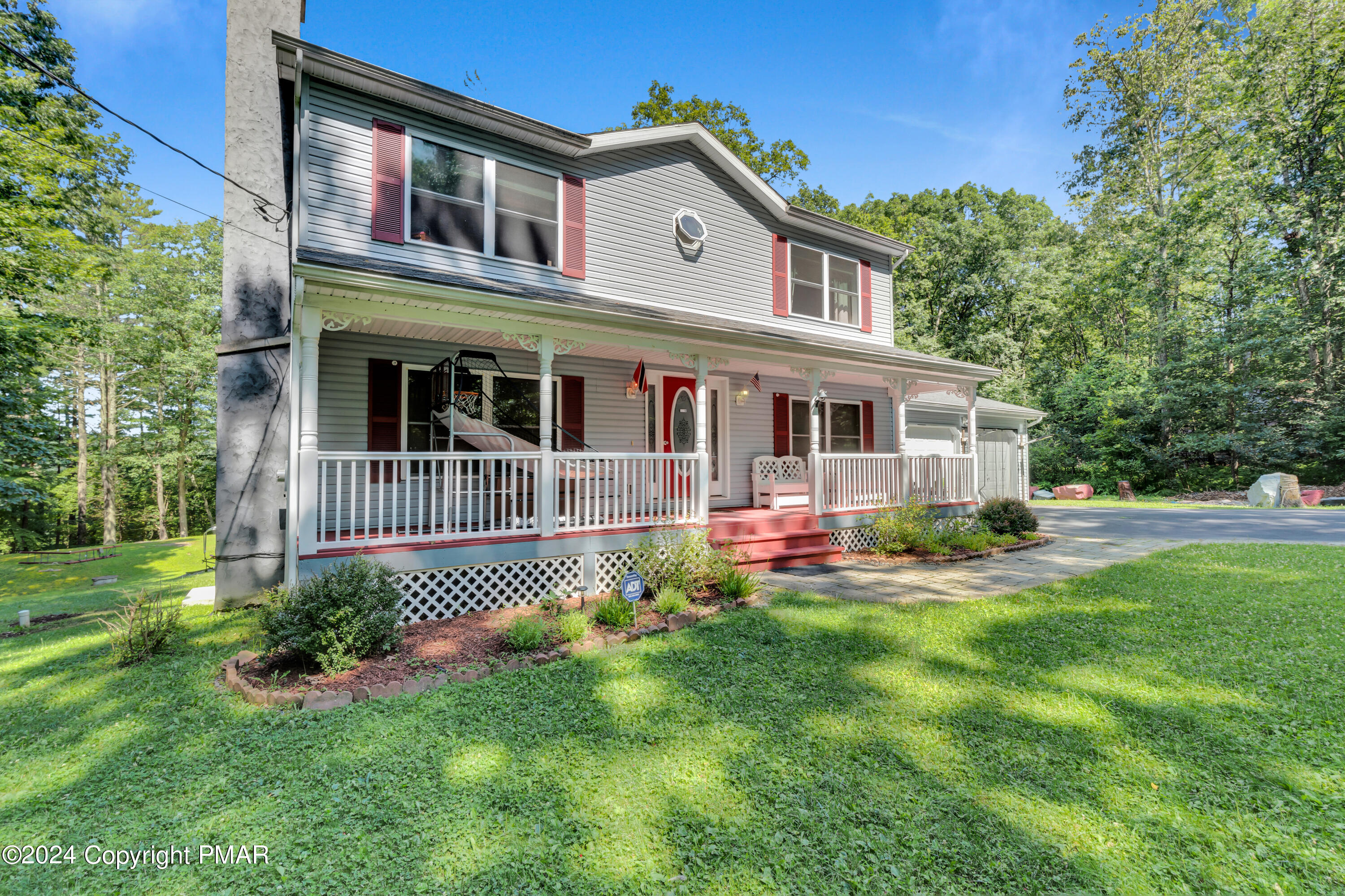 a front view of a house with a yard and porch