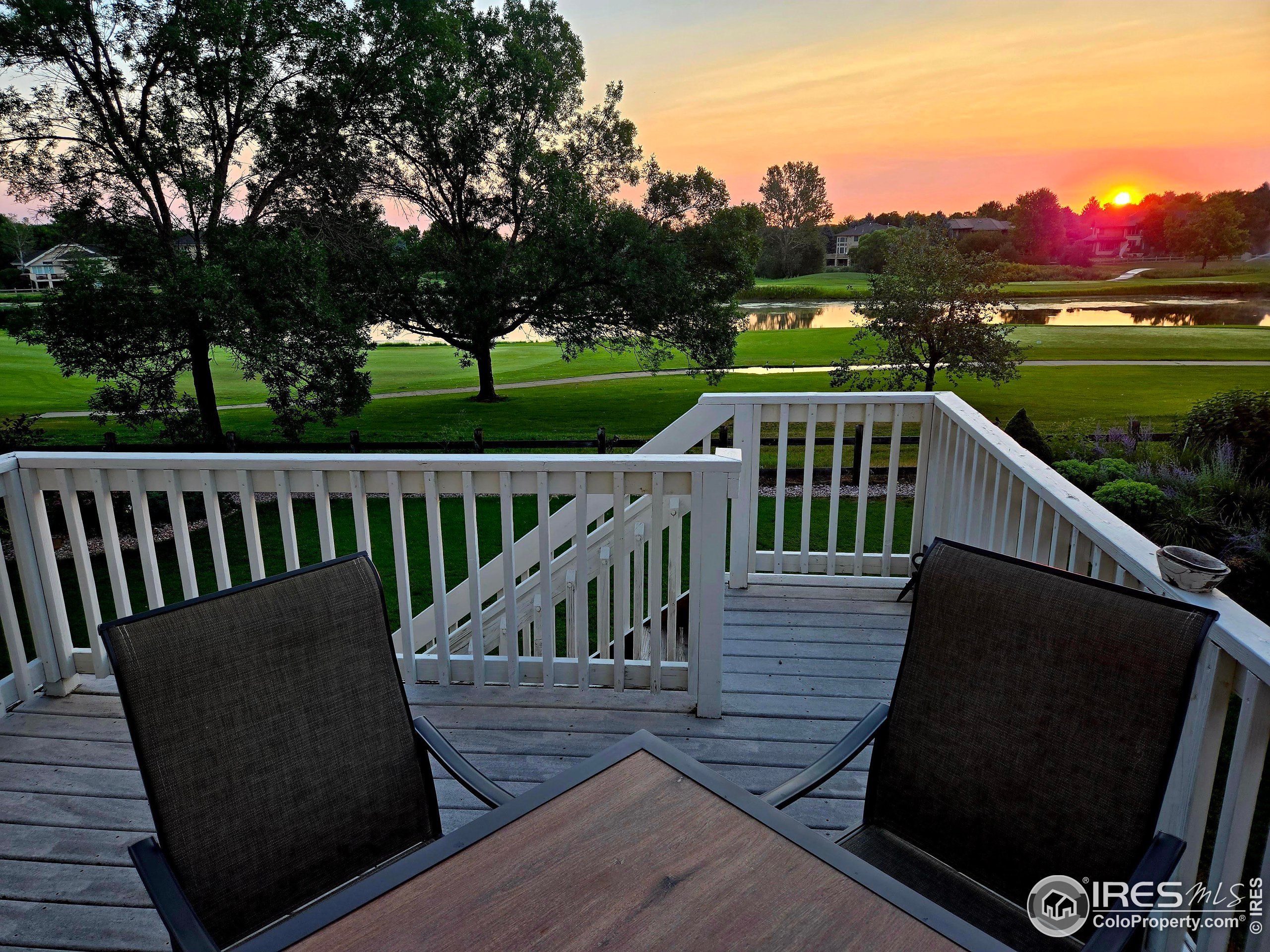 a view of a two chairs on the roof deck