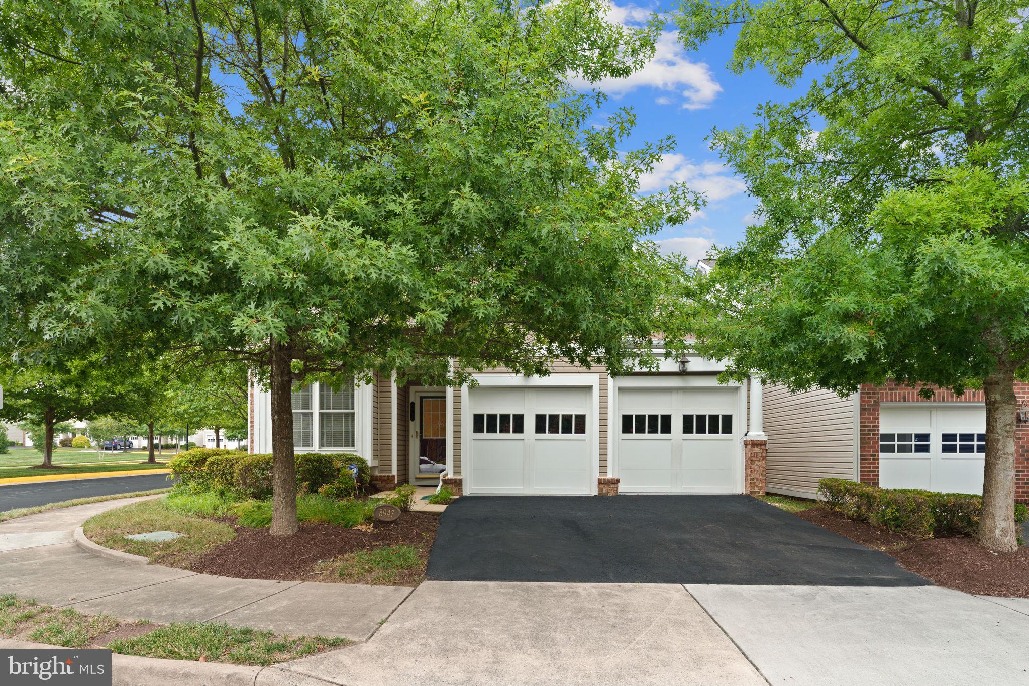 front view of a house with a garden