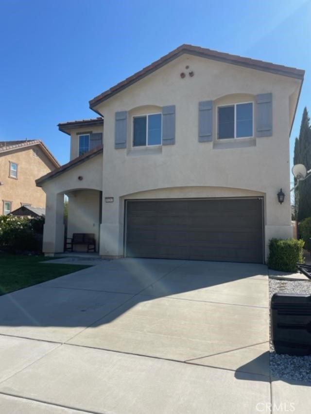 a front view of a house with garage