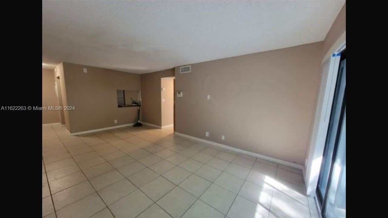 a view of an empty room and window