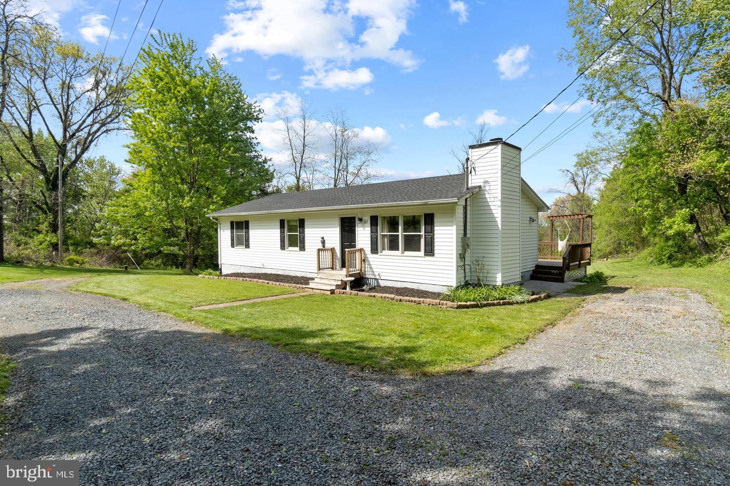 a front view of a house with a yard and porch