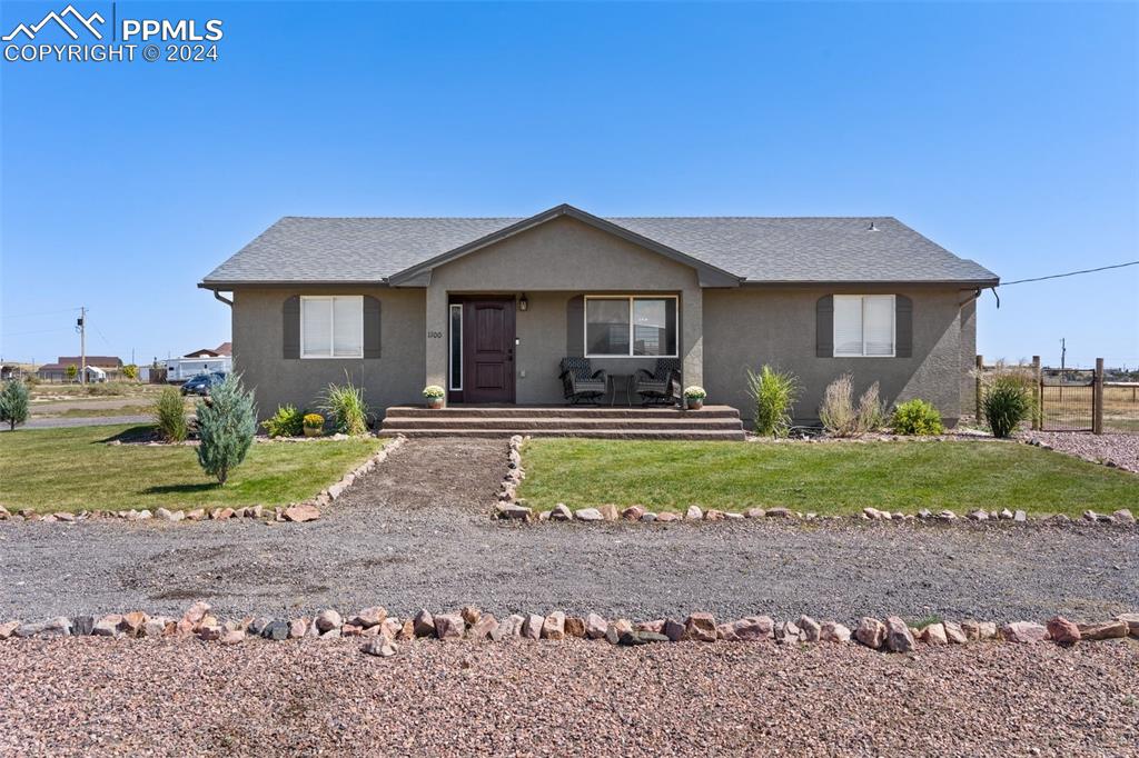 a view of a house with a yard and a yard