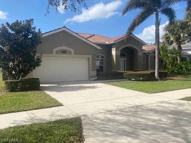 a front view of a house with yard