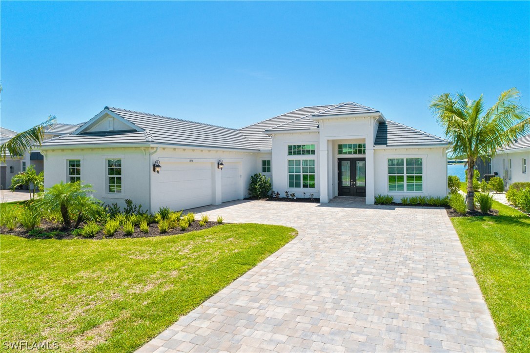 a front view of a house with a yard