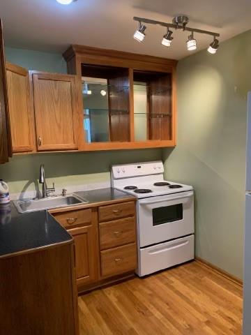 a kitchen with a sink stove and cabinets